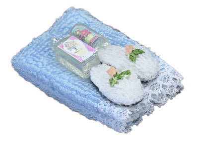Blue Towel With Lotion And Slippers
