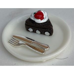 Chocolate Cake on A plate With Cutlery