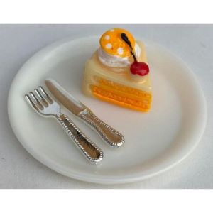 Orange Cake on A Plate With cutlery